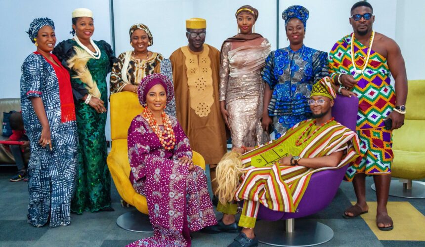 A group photo of Palton Morgan employees in African attires